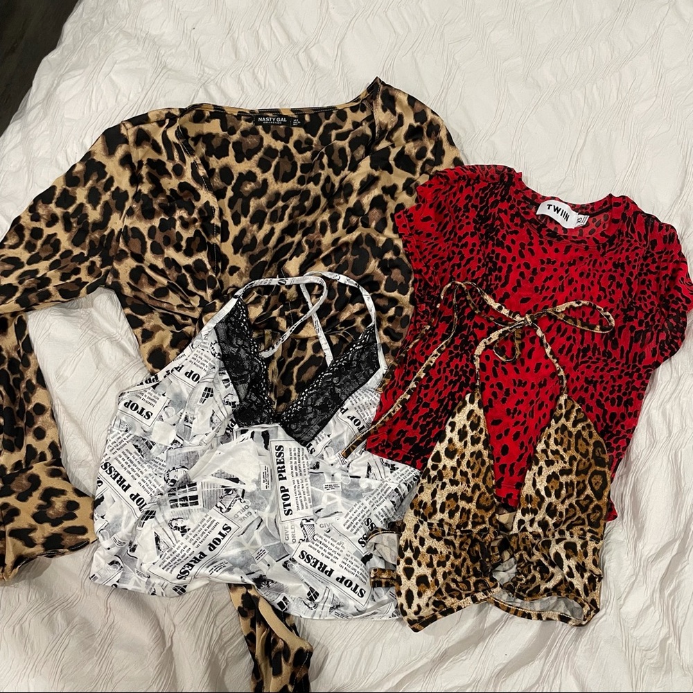 Lot of four patterned animal print / newsprint crop tops.